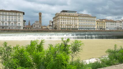 Wall Mural - Florence, Italy - 2020, June 17: the Arno river shore, on a cloudy spring day.