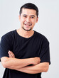 © jittima - Young man crossed arms while standing.