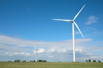 Beautiful view of field with wind turbines. Alternative energy source