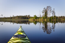 Yellow Kayak On A Calm Forest Lake. Kayak In Focus, Background Blurred.