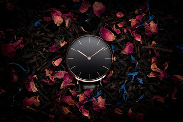 A luxury gold watch with a black dial. . Woman/Man fashion. Women's gold watch on the background of beautiful flowers. Advertising photography of the watch
