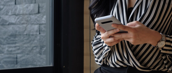 Asian woman using smartphone for social network