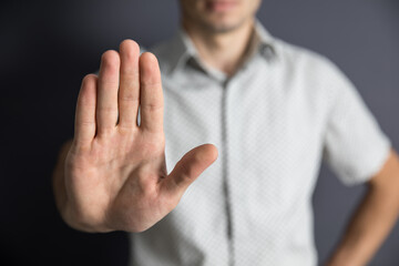 man hand stop sign