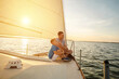 © Andrii IURLOV - Happy traveler father and son enjoying sunset from deck of sailing boat moving in sea at evening time. Bonding Travel, Summer, Holidays, Journey, Trip, Lifestyle, Yachting concept.