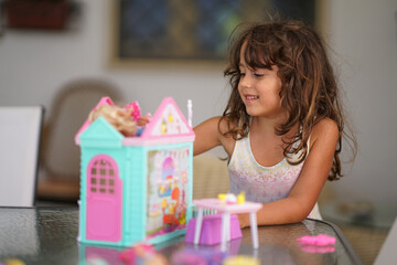 little girl plays with her favorite toys