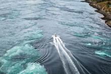 Speed-boat Passing Between Strong Tidal Currents Of Saltstraumen, Norway