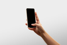 Scrolling. Close Up Female Hands Holding Smartphone With Blank Screen During Online Watching Of Popular Sport Matches, Championships. Copyspace For Ad. Devices, Gadgets, Technologies Concept.