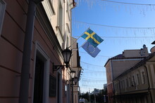 Swedish And EU Flag Fluttering On Building Wall