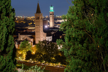 Wall Mural - Night photo from the terrace of Castel San Pietro overlooking the Basilica of Santa Anastasia and Torre dei Lamberti, city of Verona, Italy.