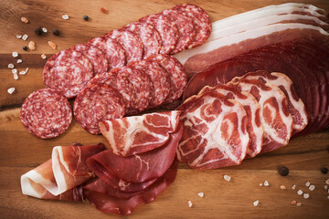 Wall Mural - various types of meat and sausages on  wooden table