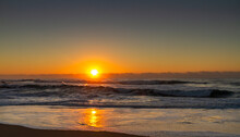 African Stock Photo Of A South African, Kwa-Zulu Natal South Coast Beach Scene With The Sun Rising Of The Ocean