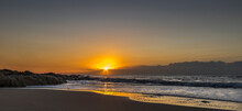 African Stock Photo Of A South African, Kwa-Zulu Natal South Coast Beach Scene With The Sun Rising Of The Ocean