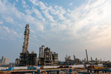 Fototapeta Krajobraz - Refinery plant under the background of blue sky white clouds