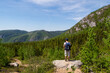 © jonas - Les Grands-Jardins national park, Canada - june 2020 : back view of a hiker admiring the landscape