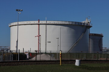 Wall Mural - Oil and chemical tanks at the terminal of Koole in the Botlek Harbor of Rotterdam.