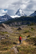 © edb3_16 - Adventure Backpacking in the Iconic Mt Assiniboine Provincial Park near Banff, Alberta, Canada. Girl Hiker with Canadian Mountain Landscape in Background.