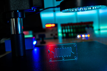 Poster - Organ-on-a-chip (OOC) - microfluidic device chip that simulates biological organs that is type of artificial organ. Prototype of design lab-on-a-chip in microfluidic laboratory