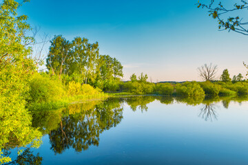 Canvas Print - Lake water sunset and nature autumn landscape with blue sky