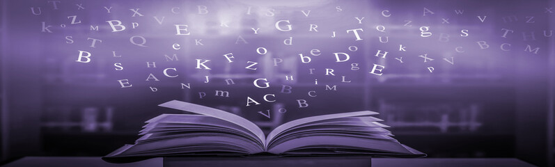 Poster - ancient book opened on a wooden table with a sparkling golden background. With magical power, magic, lightning around a glowing book In the room of darkness
