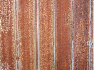 Brown rusty stain on corrugated zinc panel outdoor