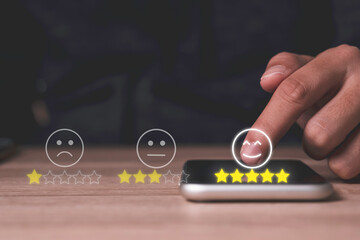 Poster - Hand touch on mobile phone to add five yellow stars to customer evaluates products and services. Customer satisfaction and marketing survey rating concept.