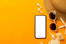 Summer Background With Blank Screen Phone And Beach Accessories - Sunglasses, Straw Hat On Vibrant Orange Background Top View With Copy Space.
