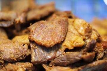 Wall Mural - Close up of Fried Pork with fish sauce thai street food market