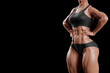 © PixlMakr - Sexy female bodybuilder in black sportswear