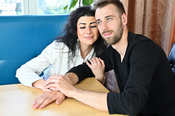 Photo of happy loving family relationship of a young man and woman in a room at home