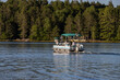 pontoon boat cruising  on lake