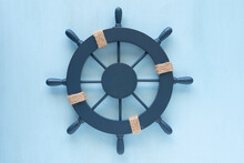 Steering Wheel On Blue Wooden Background.