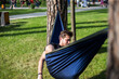 © Hennadii - Young guy has a rest in summer in a hammock