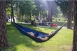 © Hennadii - Young guy has a rest in summer in a hammock