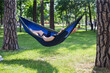 © Hennadii - Young guy has a rest in summer in a hammock
