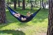 © Hennadii - Young guy has a rest in summer in a hammock