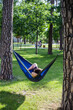 © Hennadii - Young guy has a rest in summer in a hammock
