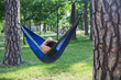 © Hennadii - Young guy has a rest in summer in a hammock