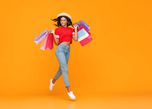 Concept Of Shopping Purchases And Sales Of Happy   Girl With Packages  On Yellow Background.