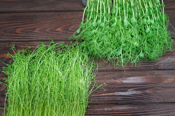 Wall Mural - Mixed Microgreens in box on wooden table background.