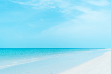 Tropical nature clean beach and white sand in summer with sun light blue sky and bokeh background.