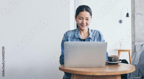 using computer.woman hand typing keyboard laptop online chatting search form internet while working sitting at coffee shop.concept for.technology device contact communication business people