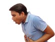 © BILLIONTECH - young Indian man feeling sick and vomiting , he want to puke , isolated on white background