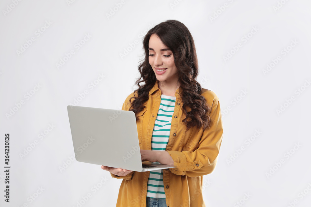 Young woman with laptop on white background Stock Photo | Adobe Stock