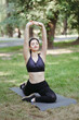 © Vadym - Morning yoga. Young fit woman doing exercises in the park. Healthy lifestyle, sport, leisure activity and balance concept