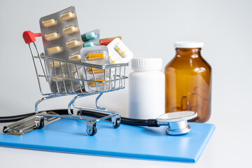 Wall Mural - Medicine, vitamins and antioxidant supplements in trolley or cart delivery and drug bottle on white background