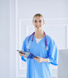 © lenets_tan - Smiling female doctor with a folder in uniform standing