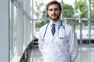 Wall Mural - happy male medical doctor portrait in hospital.