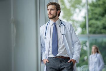 Wall Mural - happy male medical doctor portrait in hospital.