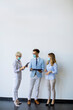 © BGStock72 - Business partners standing and looking at business results in office  while wearing face masks sa an virus protection