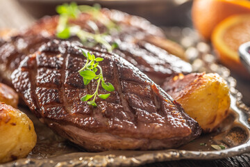 Wall Mural - Detail of tasty roasted duck breasts and potatoes on a vintage plate